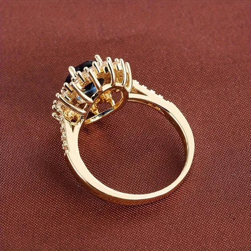 Delphine – Stilvoller goldener Ring mit blauem Stein
